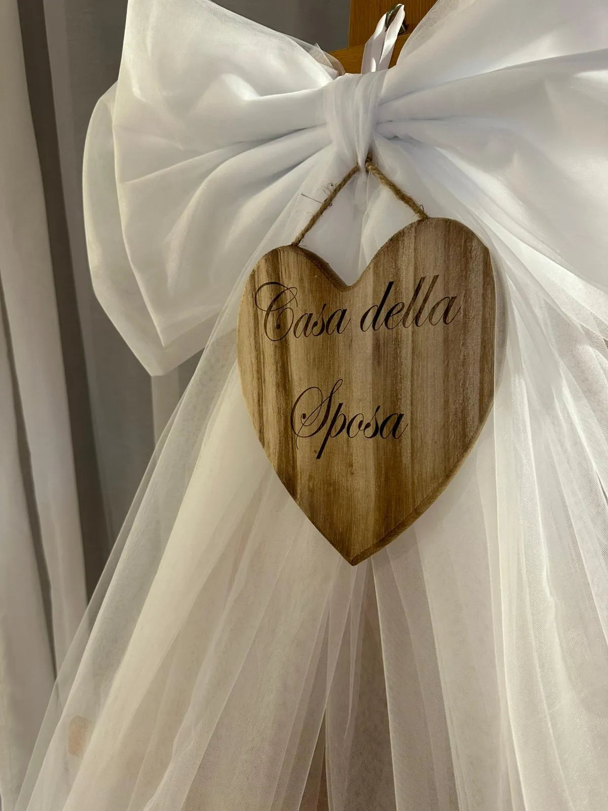 Retroporta fiocco con targhetta in legno personalizzata